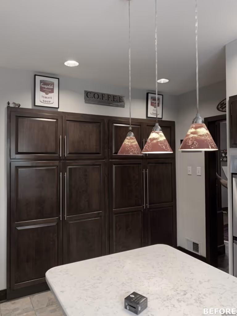 Contemporary kitchen with dark wood cabinets, pendant lighting, and a spacious countertop in Harrisburg, PA