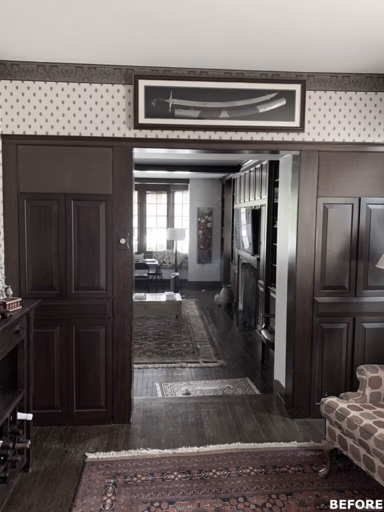 Traditional living room with dark wood accents, vintage rugs, and detailed wallpaper in Harrisburg, PA