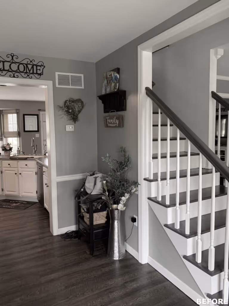Welcoming entryway in Hummelstown, PA, featuring gray walls, a staircase, and decorative plants.