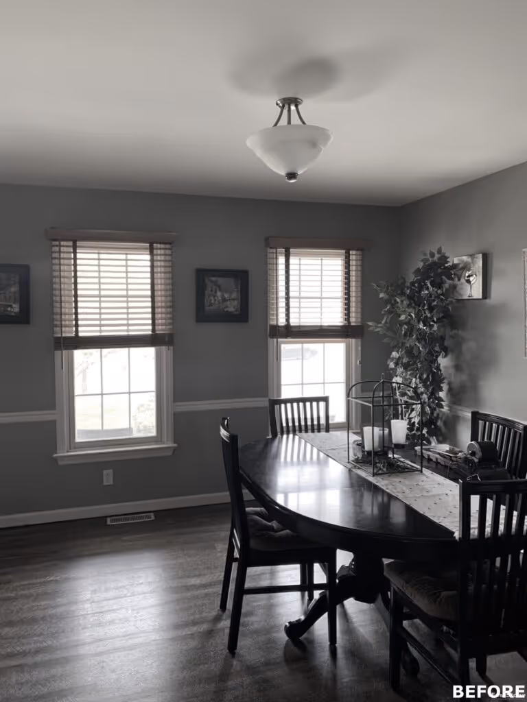 Dining room with dark wooden table, black chairs, and neutral gray walls in Hummelstown, PA.
