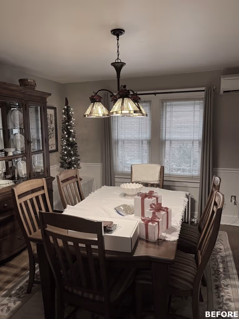 Rustic dining room in Camp Hill, PA featuring wooden furniture, a stained glass chandelier, and holiday decorations.