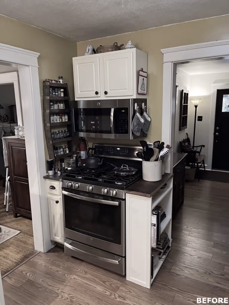 Cozy kitchen in Camp Hill, PA featuring a gas stove, wooden shelves, and light-colored cabinetry