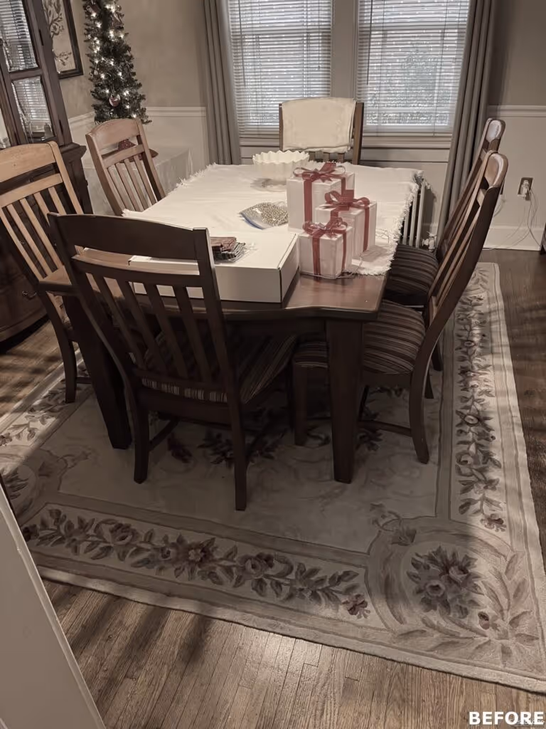Cozy dining room in Camp Hill, PA with wooden table, gifts, and decorative rug, perfect for holiday gatherings
