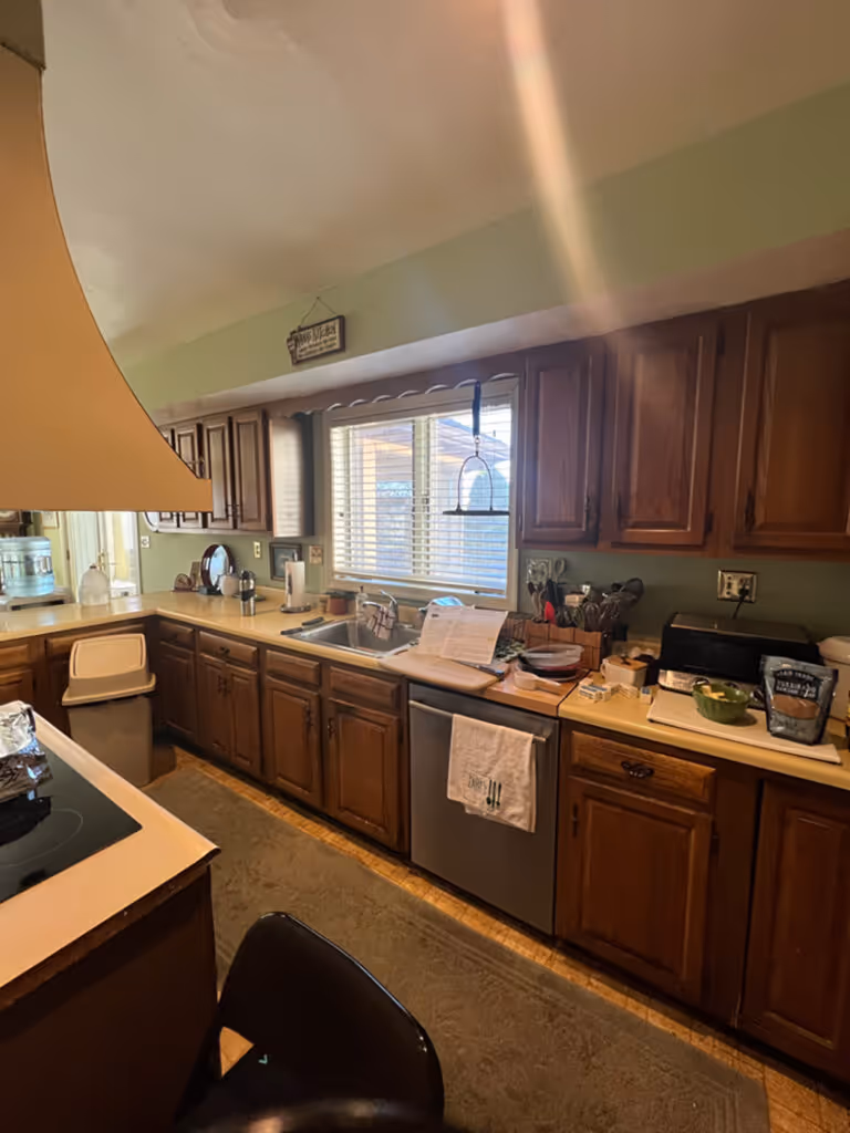 Traditional kitchen with wooden cabinets, beige countertop, and sink in mechanicsburg, pa