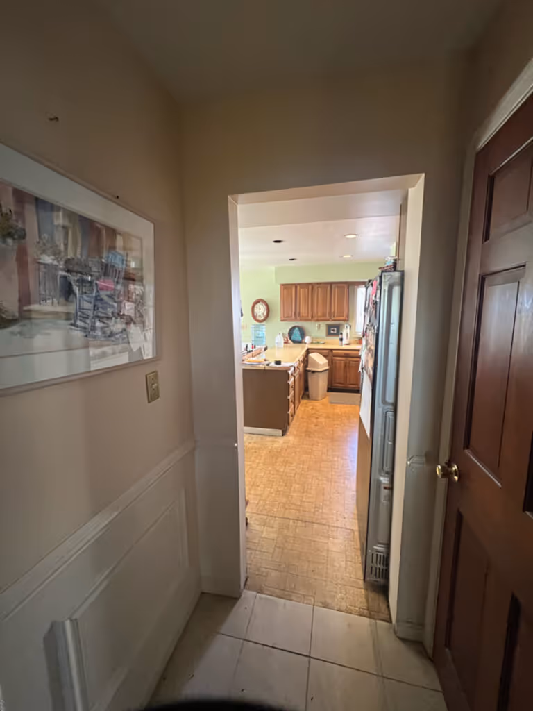 View of a kitchen in Mechanicsburg, PA, featuring wooden cabinets and a spacious layout.
