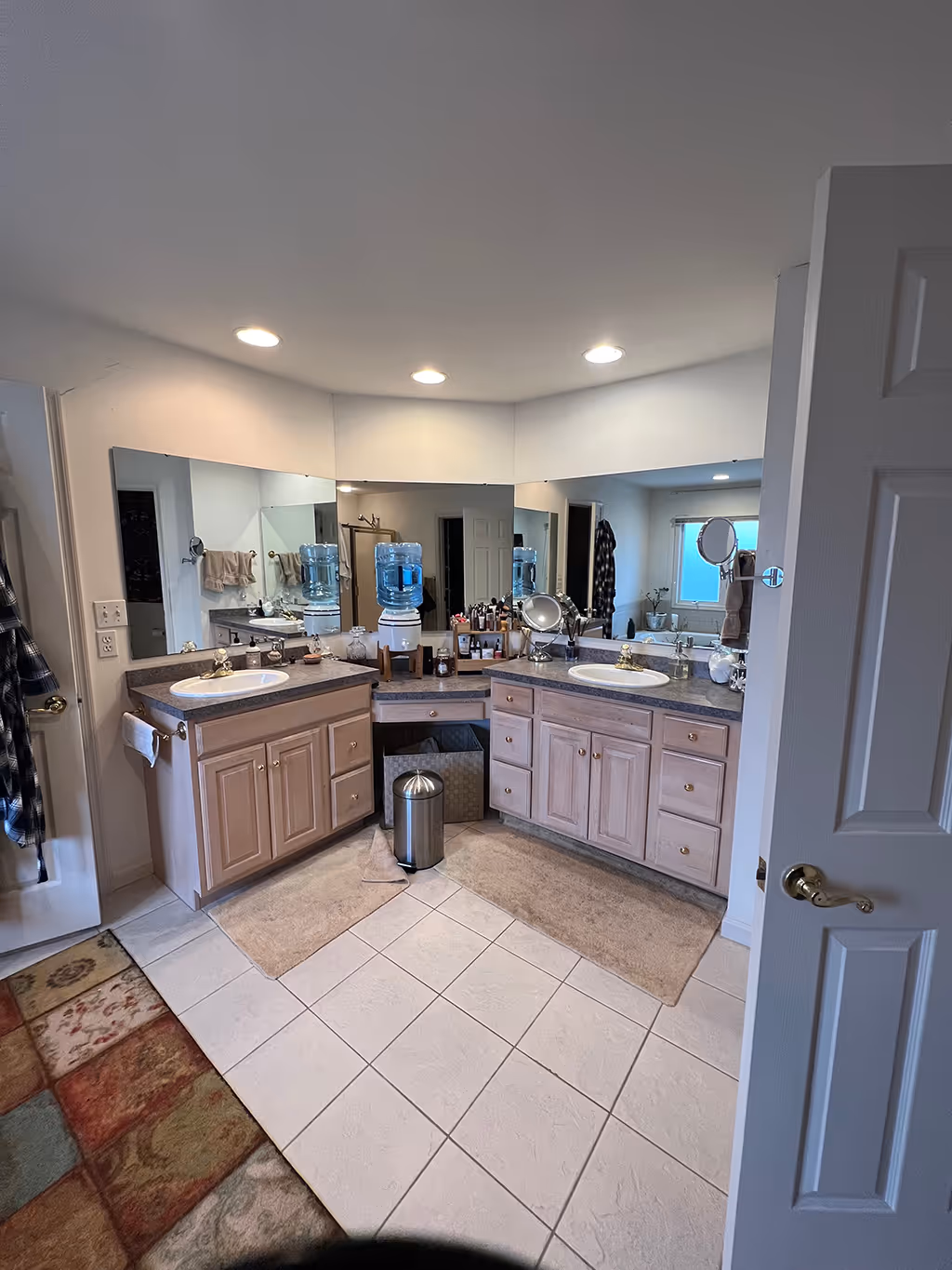 Spacious bathroom featuring dual vanities, light wood cabinets, and large mirrors in Mechanicsburg, PA