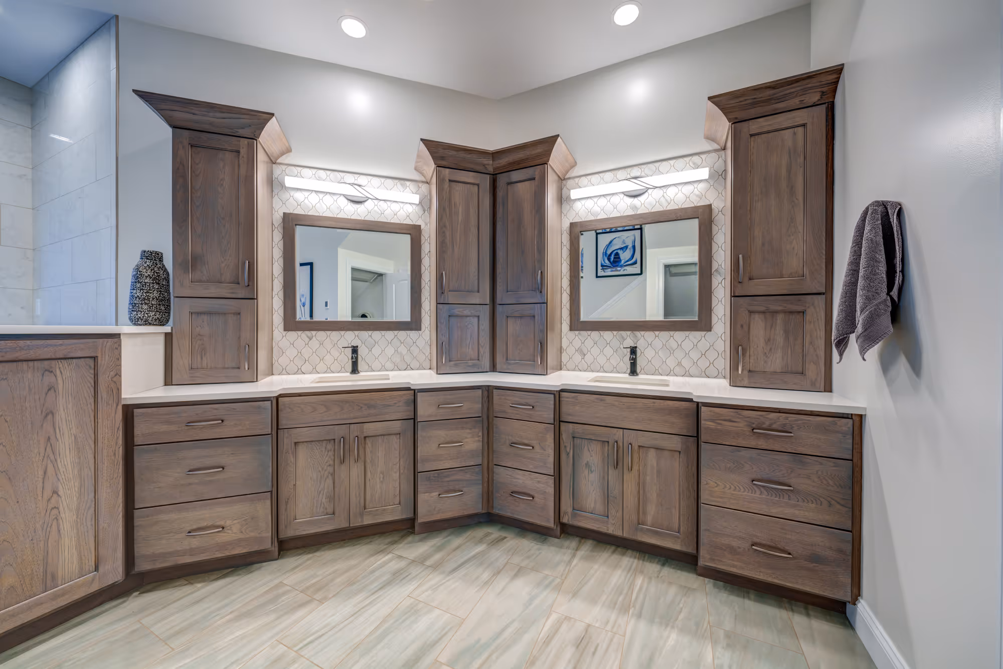 Stylish bathroom with dual vanity, dark wood cabinets, and modern fixtures in Mechanicsburg, PA.