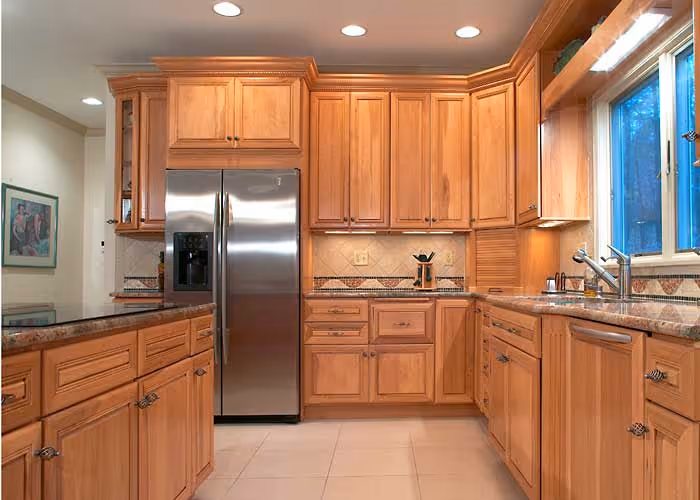 Modern kitchen with wooden cabinets, stainless steel appliances, and granite countertops in Harrisburg, PA