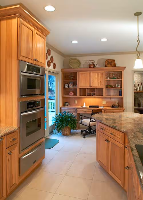 Warm wooden kitchen with modern appliances and a cozy workspace in Harrisburg, PA