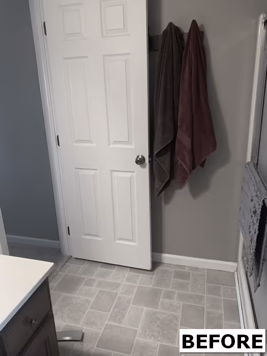 Before image of a modern bathroom in Elizabethtown, PA featuring gray walls and tiled floor.