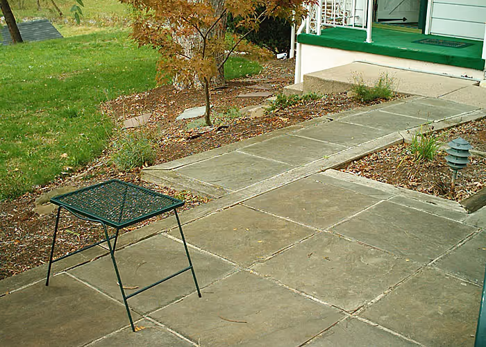 Outdoor patio with stone walkway and metal table in Harrisburg, PA