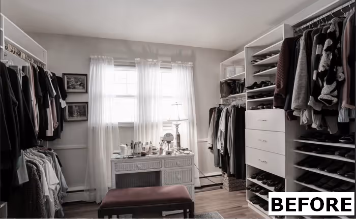 Cozy closet space in Camp Hill, PA featuring organized shelves, clothing racks, and a chic table with decor.