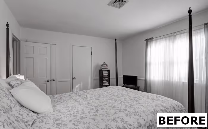 Transitional bedroom in Camp Hill, PA featuring a queen-sized bed, white floral bedding, and natural light streaming through sheer curtains.