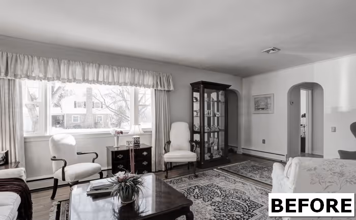 Traditional living room with a decorative rug, vintage furniture, and a china cabinet in Camp Hill, PA.