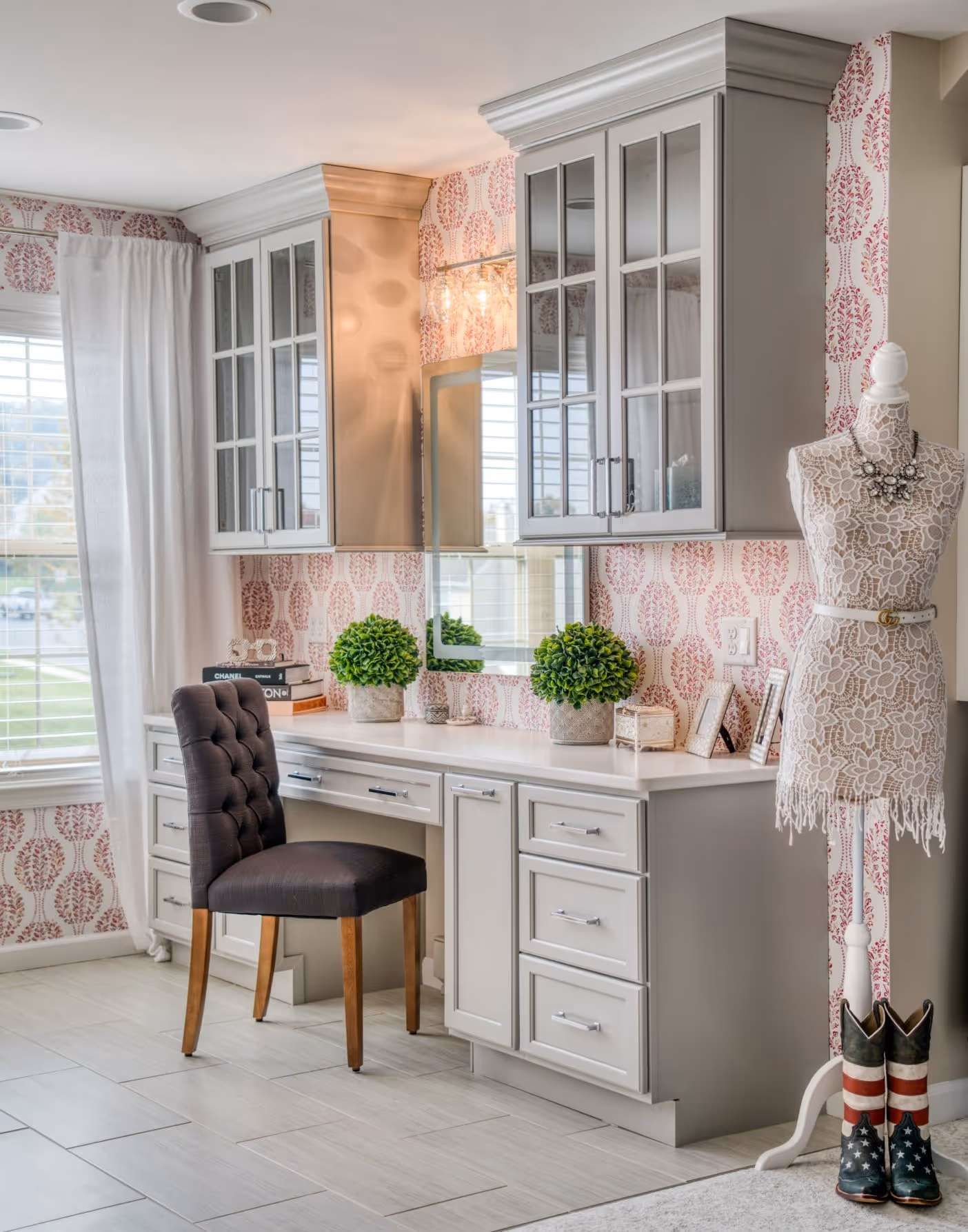 Elegant home office in Elizabethtown, PA with stylish desk, floral wallpaper, and decorative mannequin.