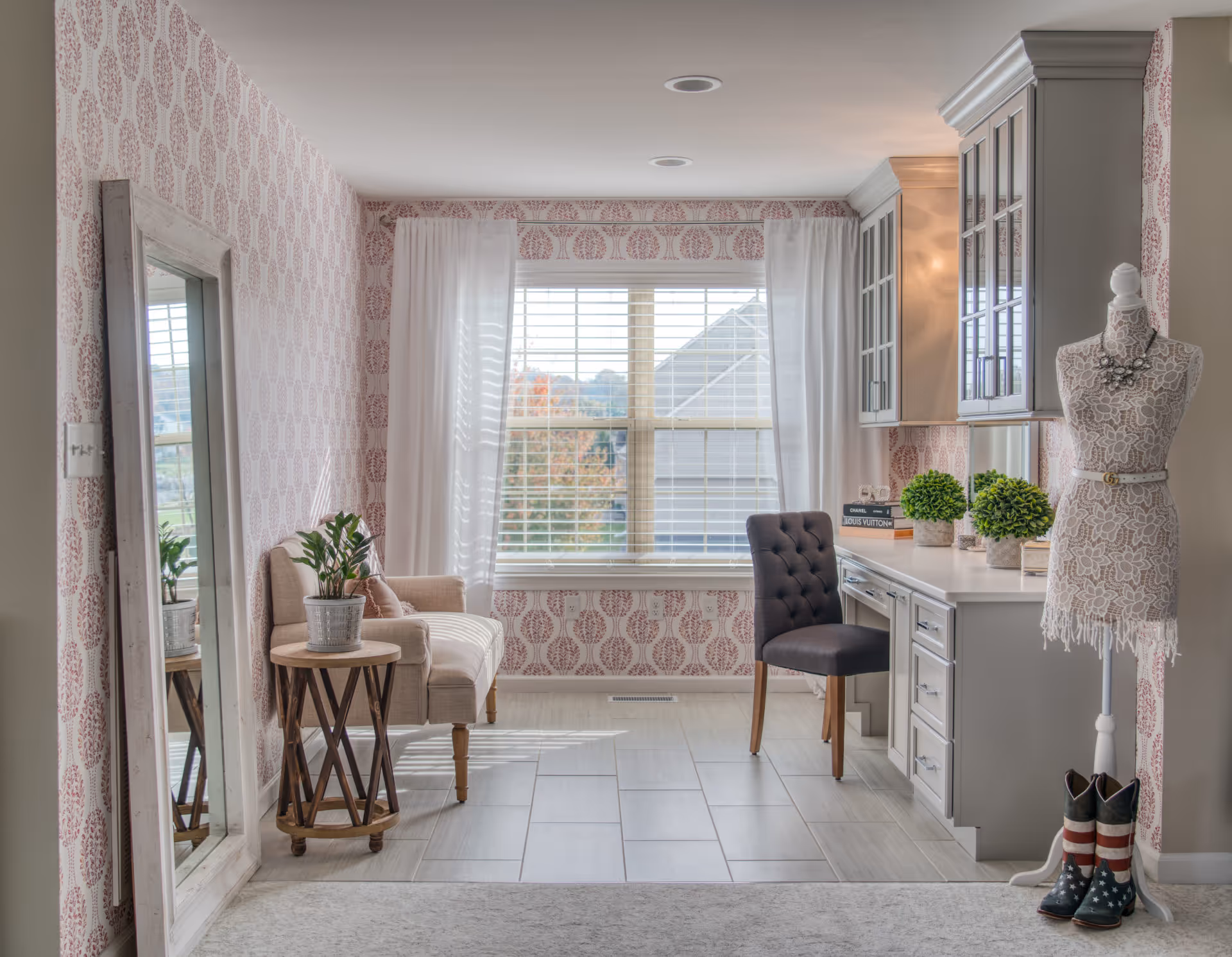 Chic home office in Elizabethtown, PA featuring gray cabinetry, textured wallpaper, and stylish decor