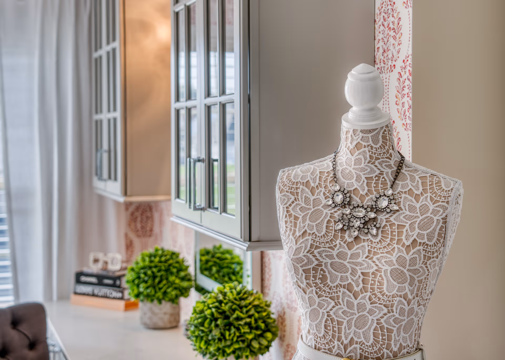 Stylish kitchen in Elizabethtown, PA featuring a lace mannequin and vibrant greenery.
