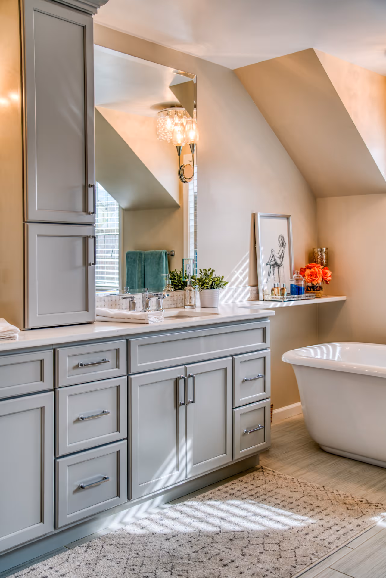 Modern bathroom featuring a freestanding tub, gray cabinetry, and elegant decor in Elizabethtown, PA.