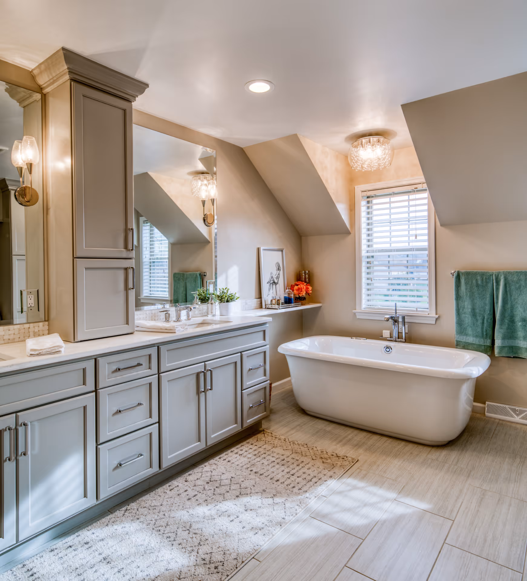 Transitional bathroom featuring a freestanding tub, gray cabinets, and elegant lighting in Elizabethtown, PA.