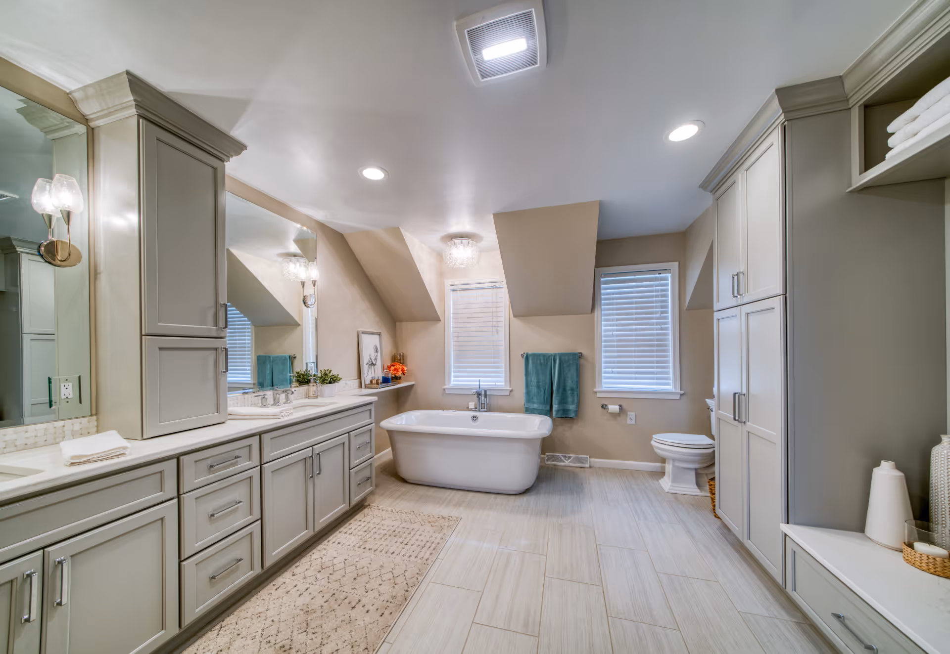 Spacious contemporary bathroom featuring a freestanding tub and gray cabinetry, located in Elizabethtown, PA.