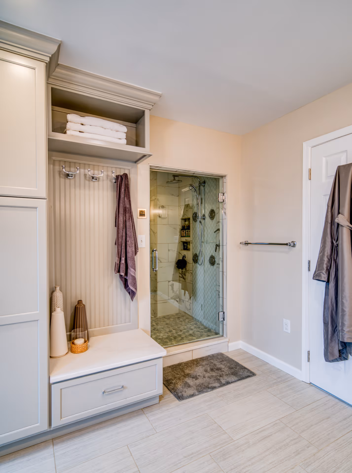 Modern bathroom with a glass shower, gray cabinetry, and stylish decor in Elizabethtown, PA.