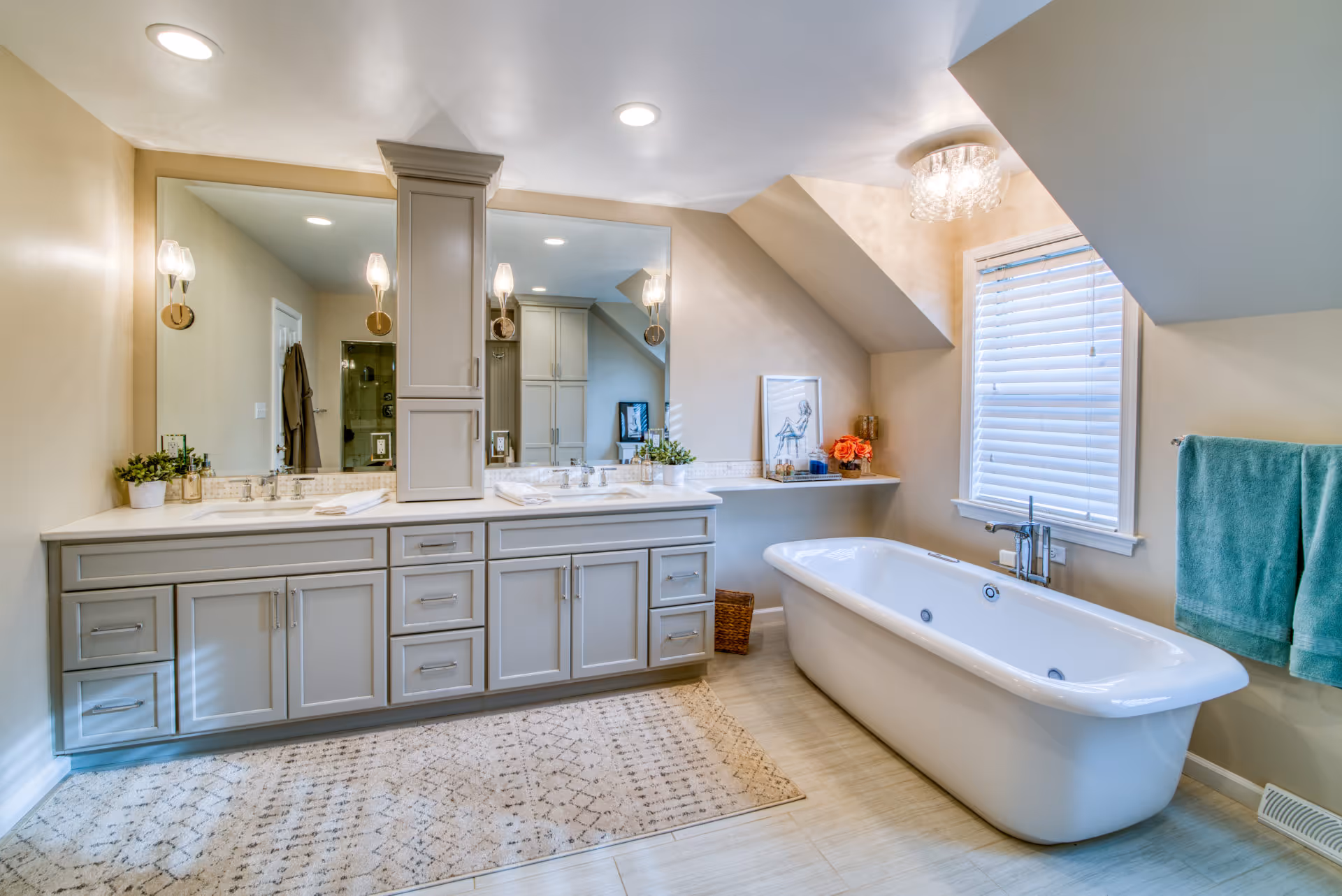 Luxurious contemporary bathroom featuring a freestanding tub, gray cabinetry, and stylish lighting in Elizabethtown, PA.