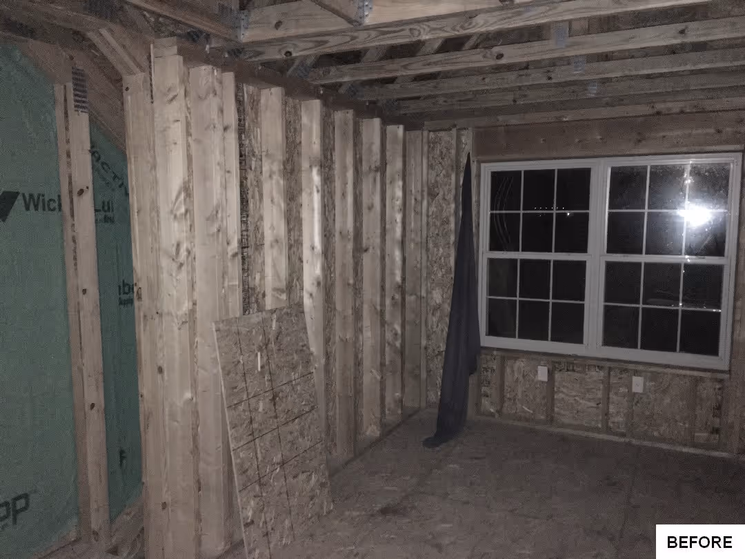 unfinished room under construction featuring wooden framing and a window in Elizabethtown, PA