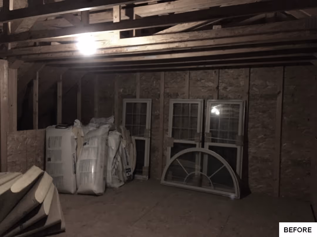 Renovation project in Elizabethtown, PA featuring an unfinished attic with exposed beams and stacked windows.