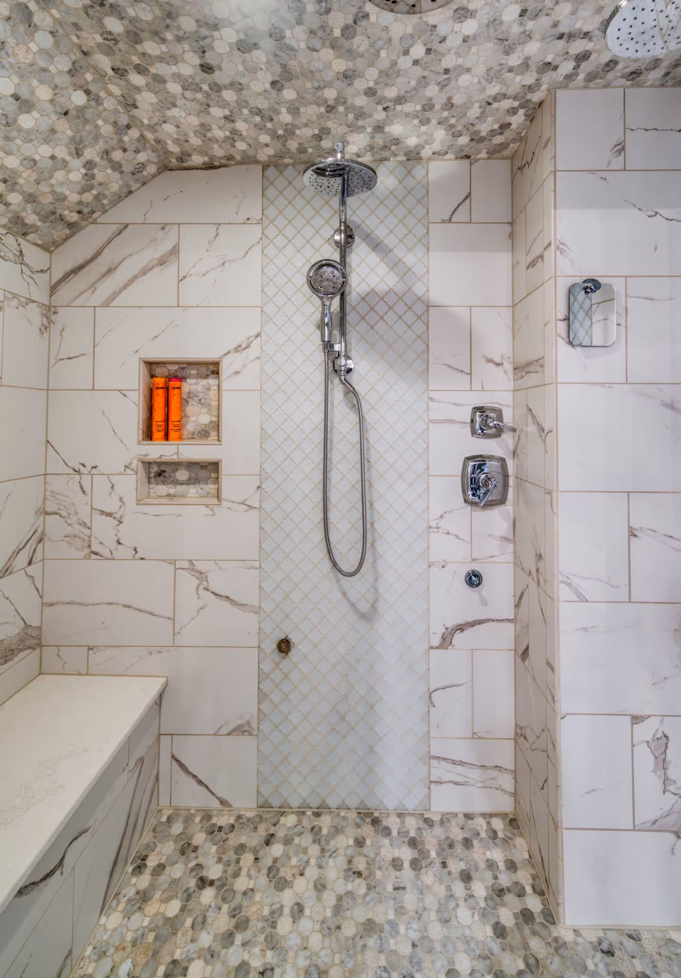 Elegant modern shower featuring marble tiles and a stylish rainfall showerhead in Elizabethtown, PA.