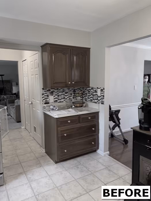 Before renovation kitchen with dark wood cabinets and mosaic backsplash in Hershey, PA.