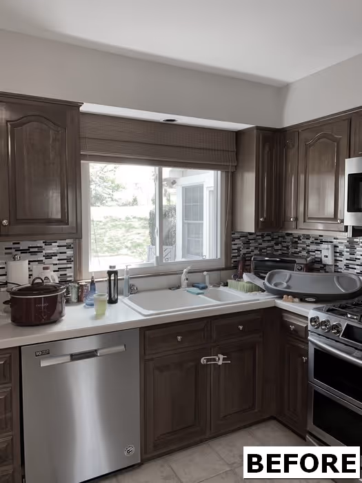Cozy kitchen before renovation with dark wood cabinets and a tiled backsplash in Hershey, PA.