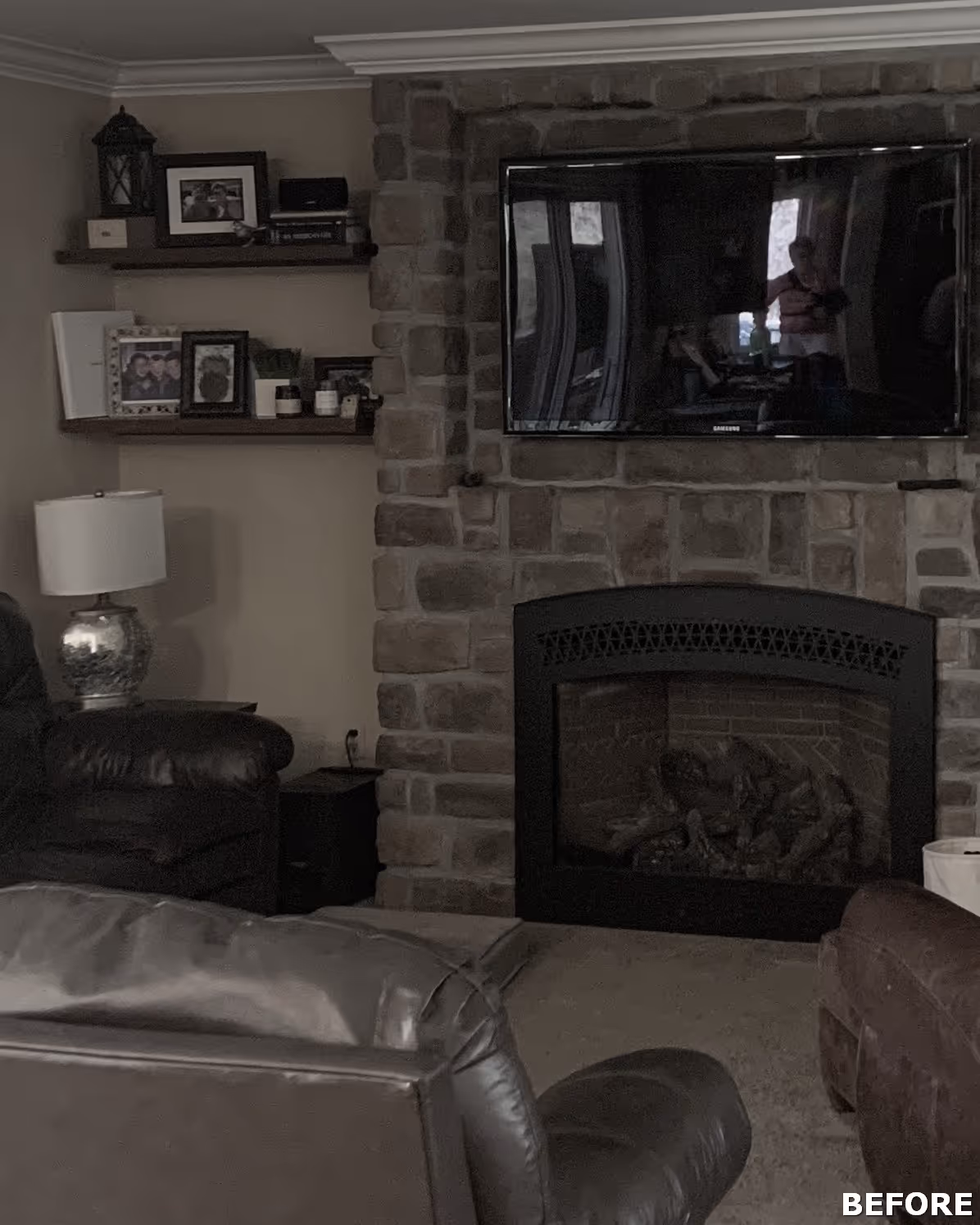 Cozy living room in Dillsburg, PA featuring a stone accent wall, modern television, and comfortable seating.
