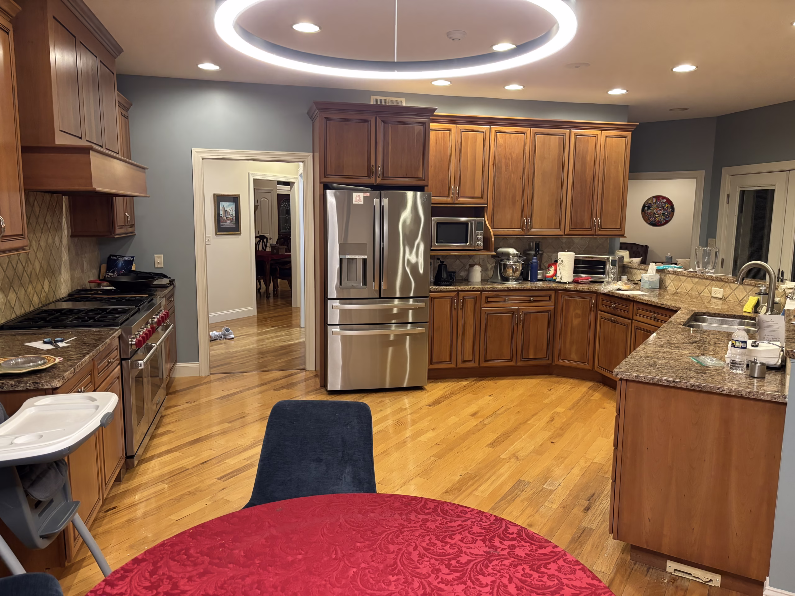 Spacious kitchen with wooden cabinets and granite countertops, featuring modern appliances in Mechanicsburg, PA.