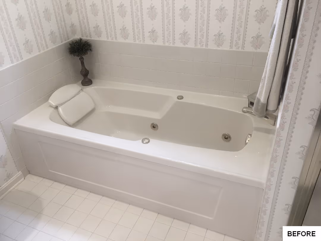 Cozy transitional bathroom featuring a white whirlpool tub and elegant floral wallpaper in hershey, pa.