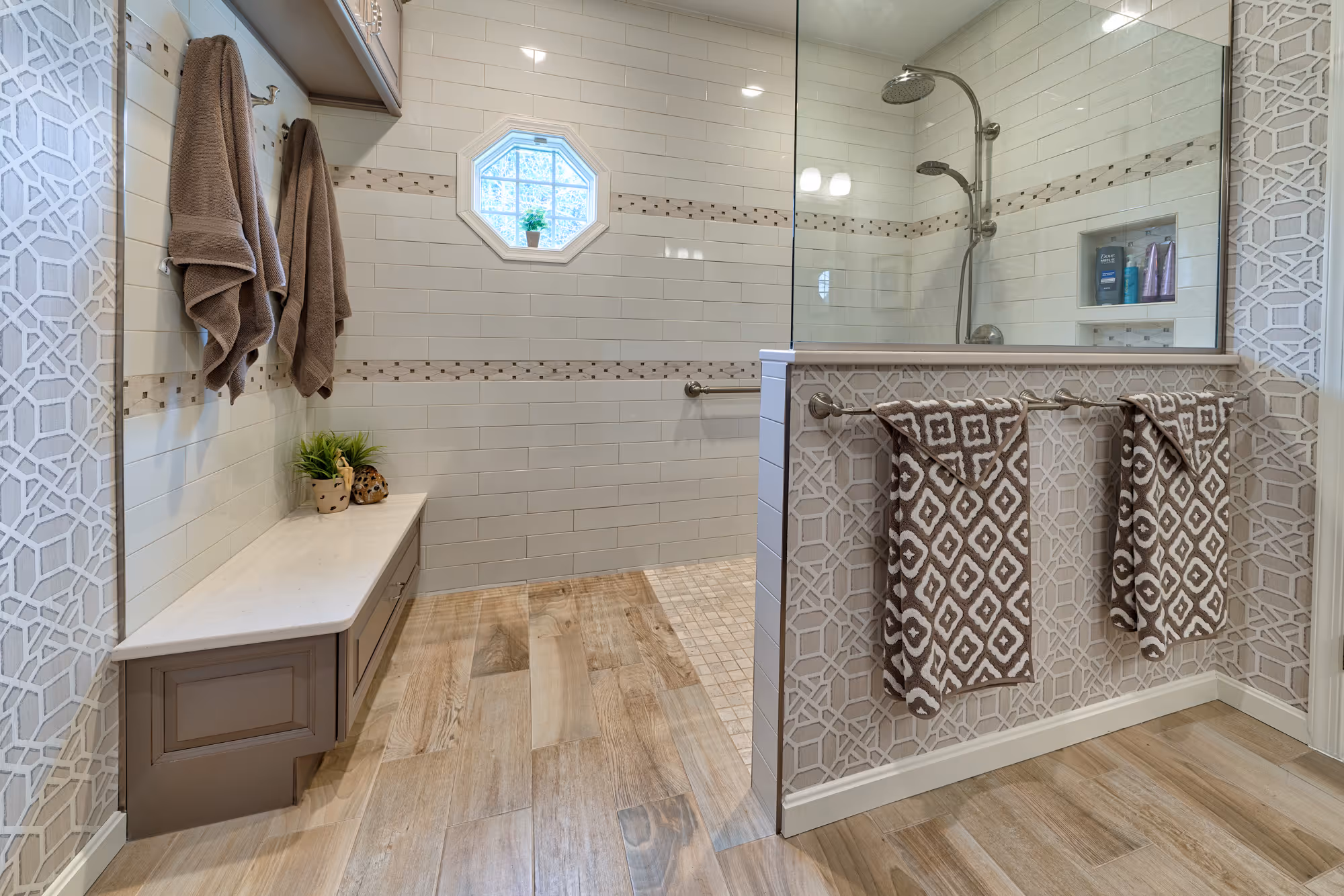 Modern bathroom in Hershey, PA featuring a walk-in shower, patterned wallpaper, and a minimalist design.