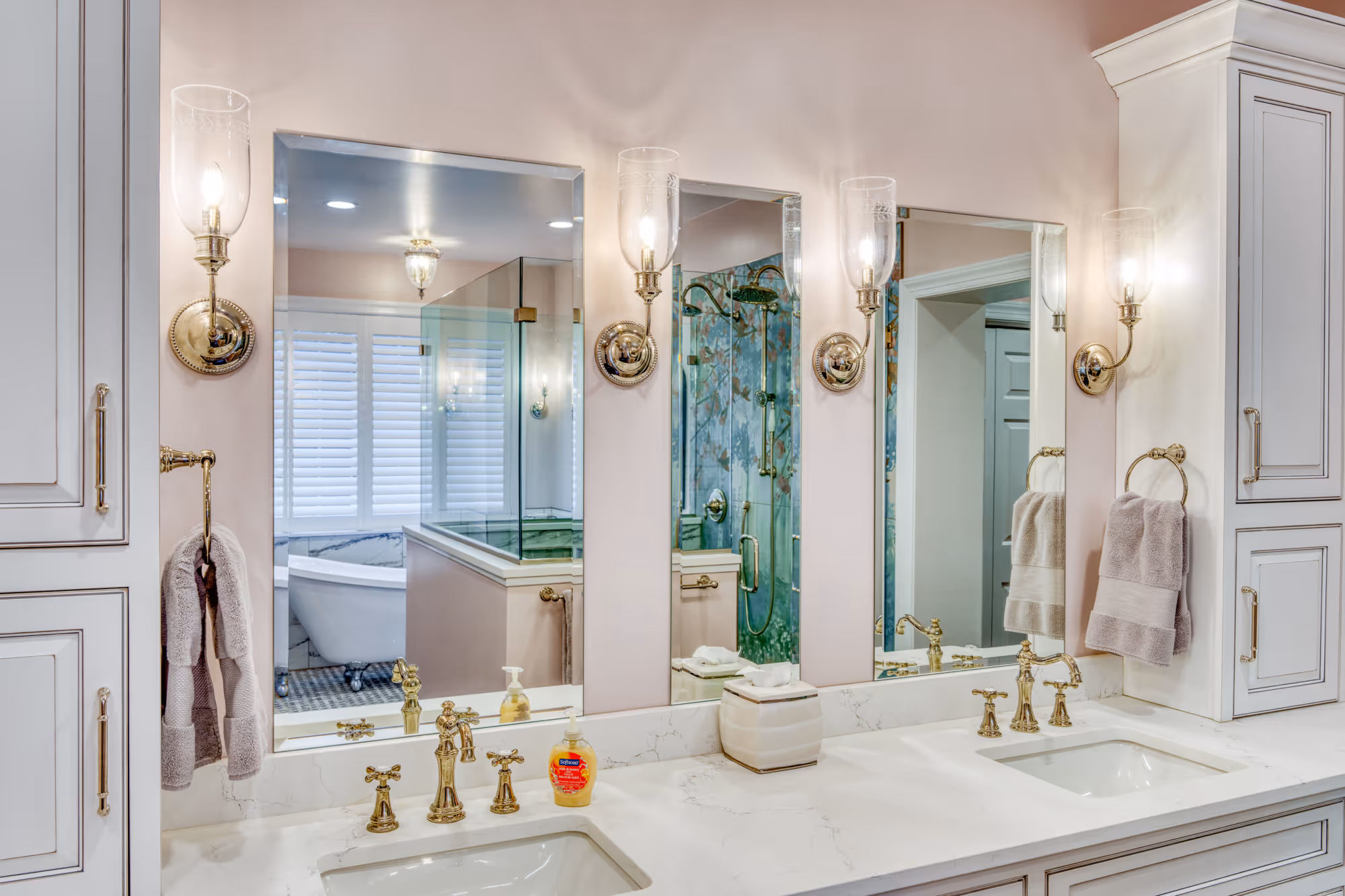 luxury bathroom with elegant mirrors and lighting, featuring marble countertop and gold fixtures in mechanicsburg pa