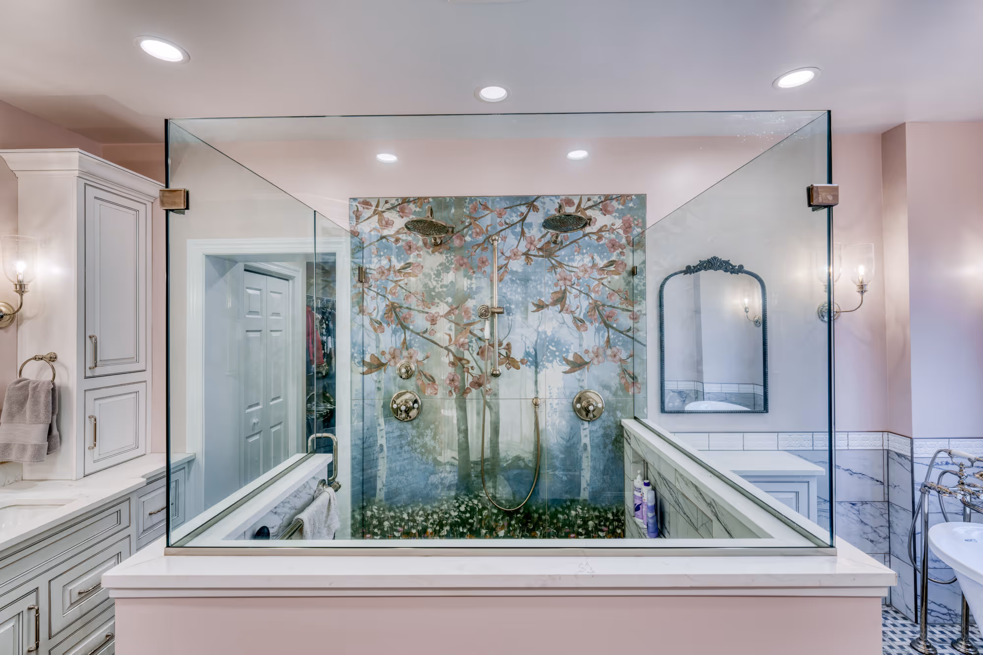 Modern bathroom in Mechanicsburg, PA featuring a glass shower with floral art wall and elegant fixtures.