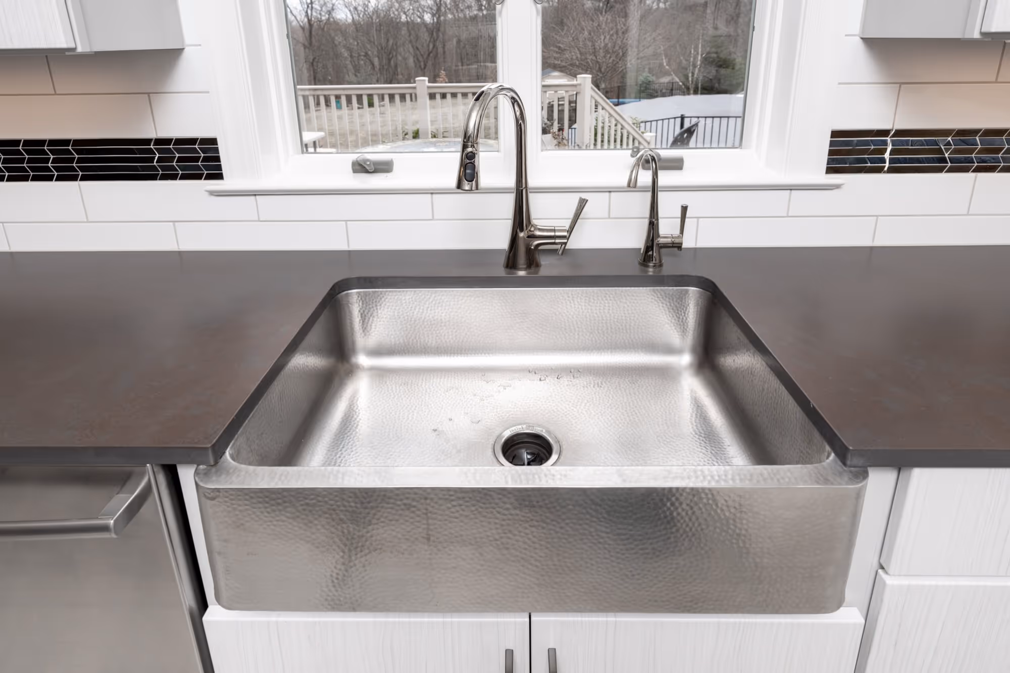 Farmhouse kitchen in Lewisberry, PA with a stylish stainless steel farmhouse sink and modern fixtures.