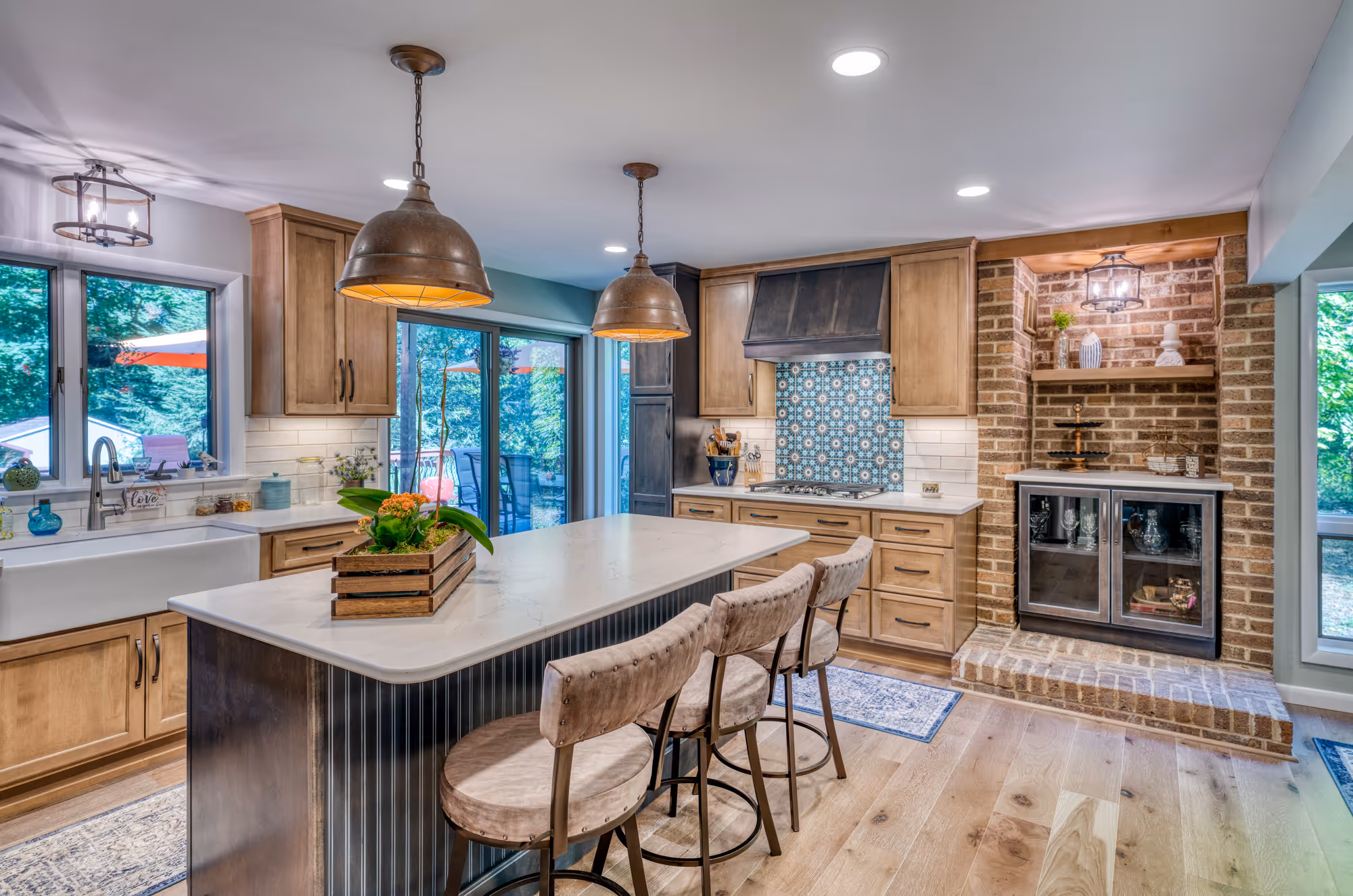 Modern kitchen in Harrisburg, PA featuring a farmhouse style, oak cabinetry, and a unique patterned backsplash.