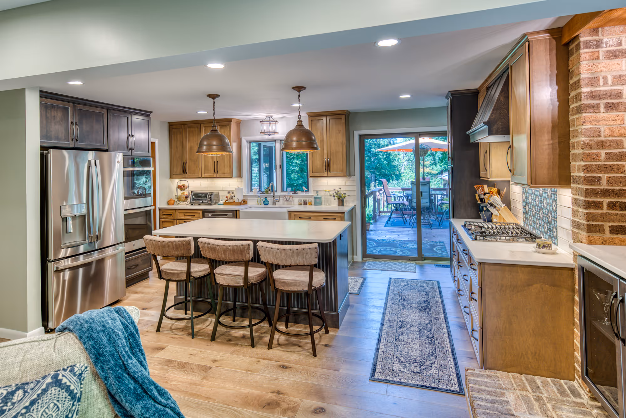 Modern kitchen design featuring brown and blue tones with wooden cabinets and a large island in harrisburg, pa