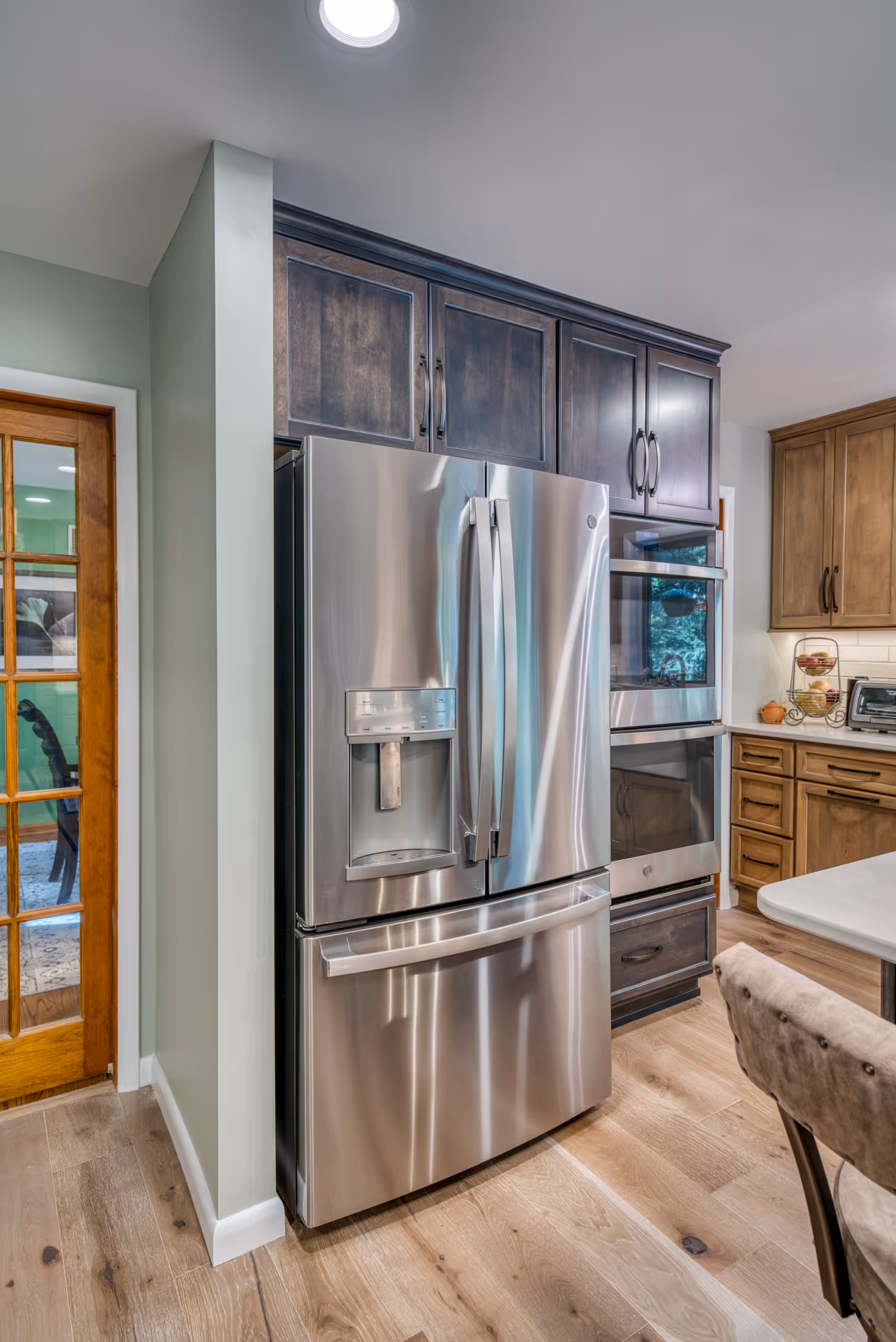 Contemporary kitchen in Harrisburg, PA featuring stainless steel appliances and wood cabinetry.