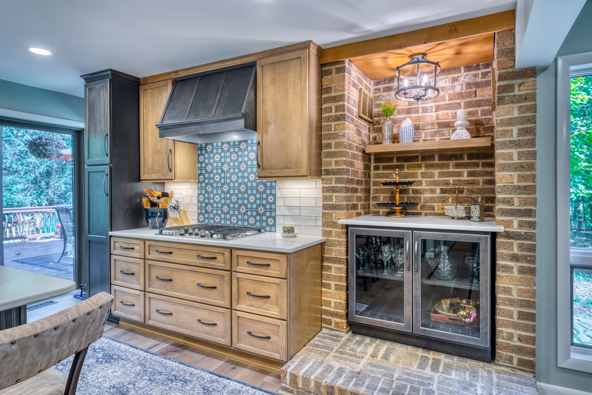 Modern kitchen with a cook range, tile accent wall, and brick details in Harrisburg, PA.