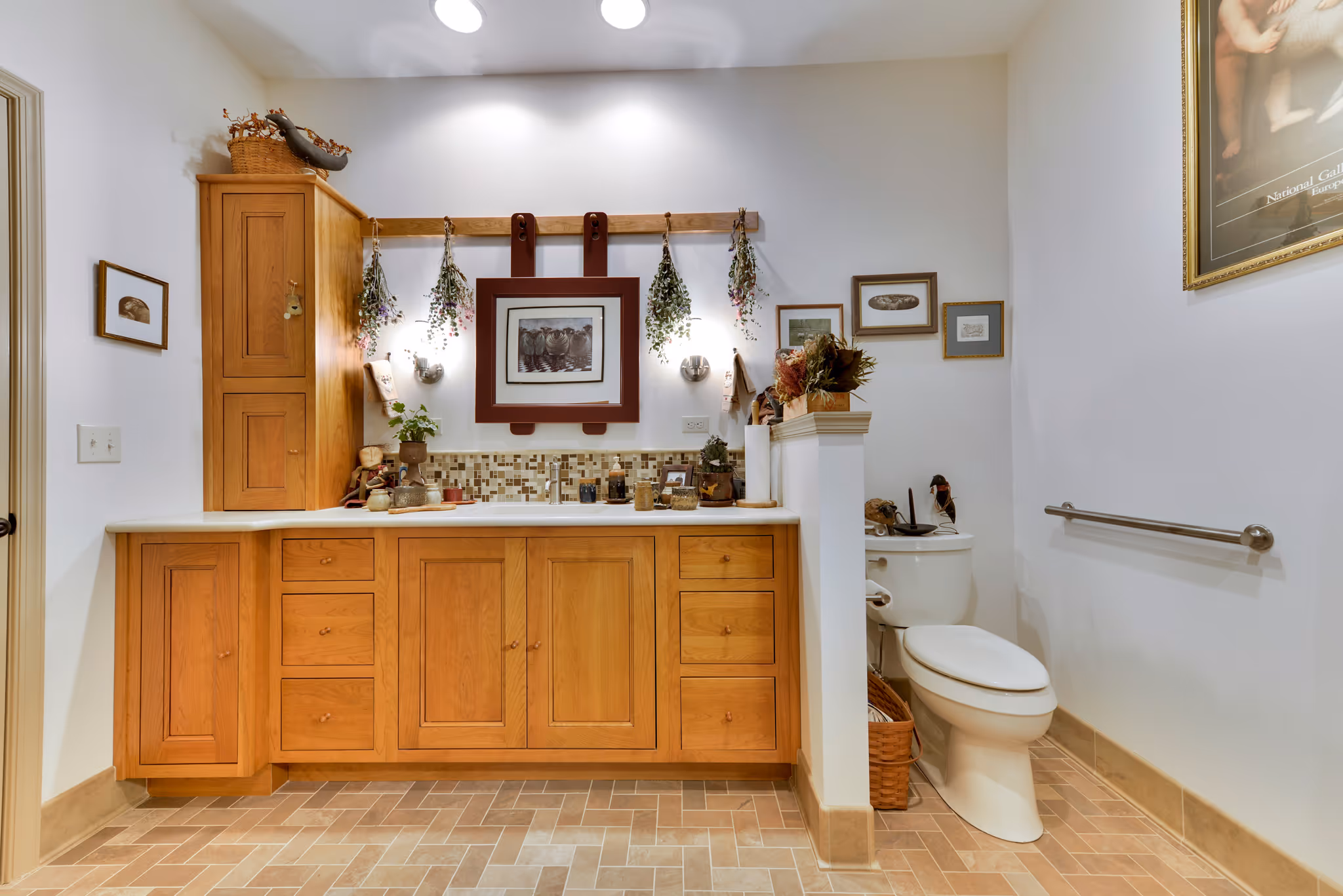 Cozy transitional bathroom in Carlisle, PA with wood cabinetry and decorative accents.