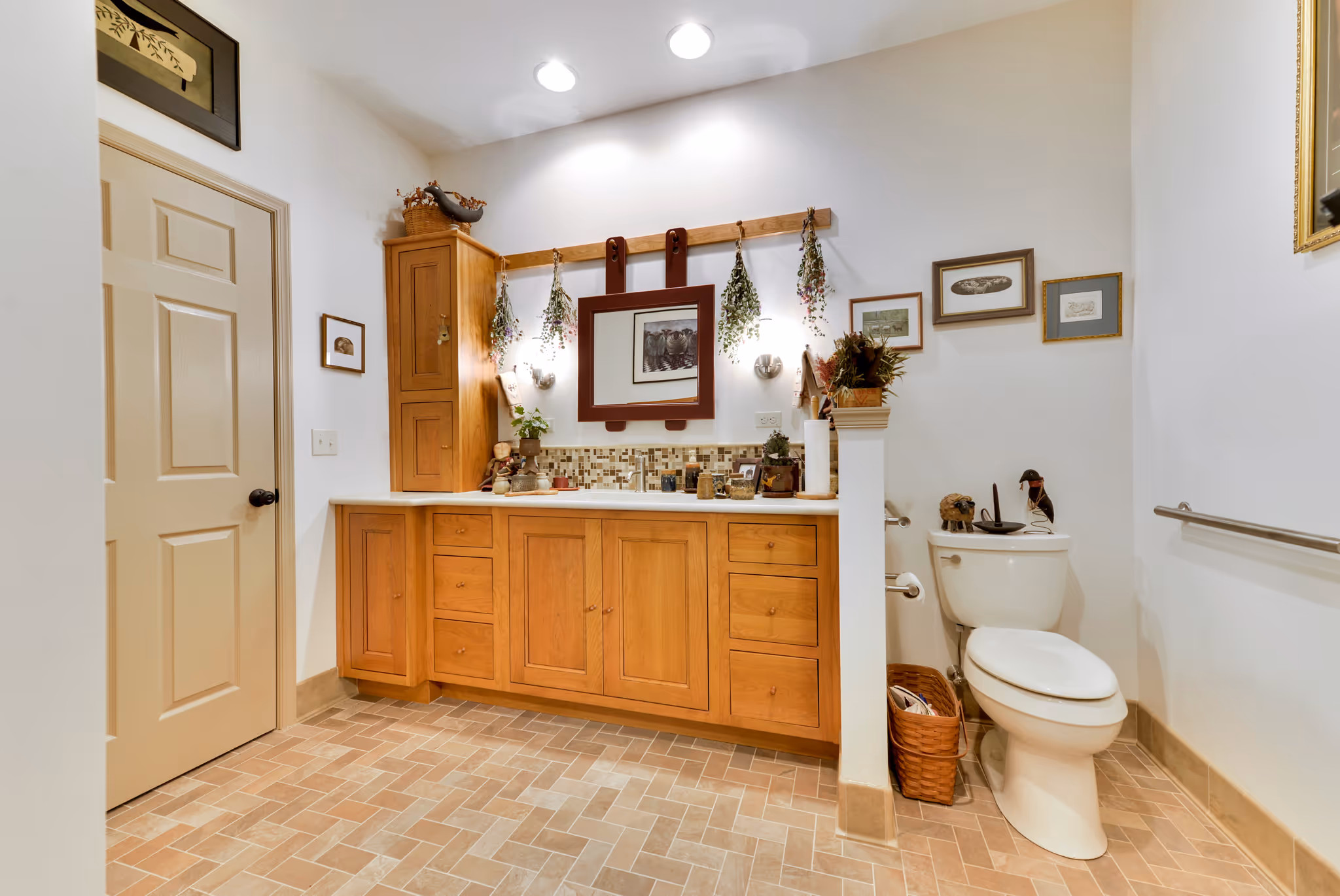 Modern bathroom design with warm wood cabinetry and decorative accents in Carlisle, PA