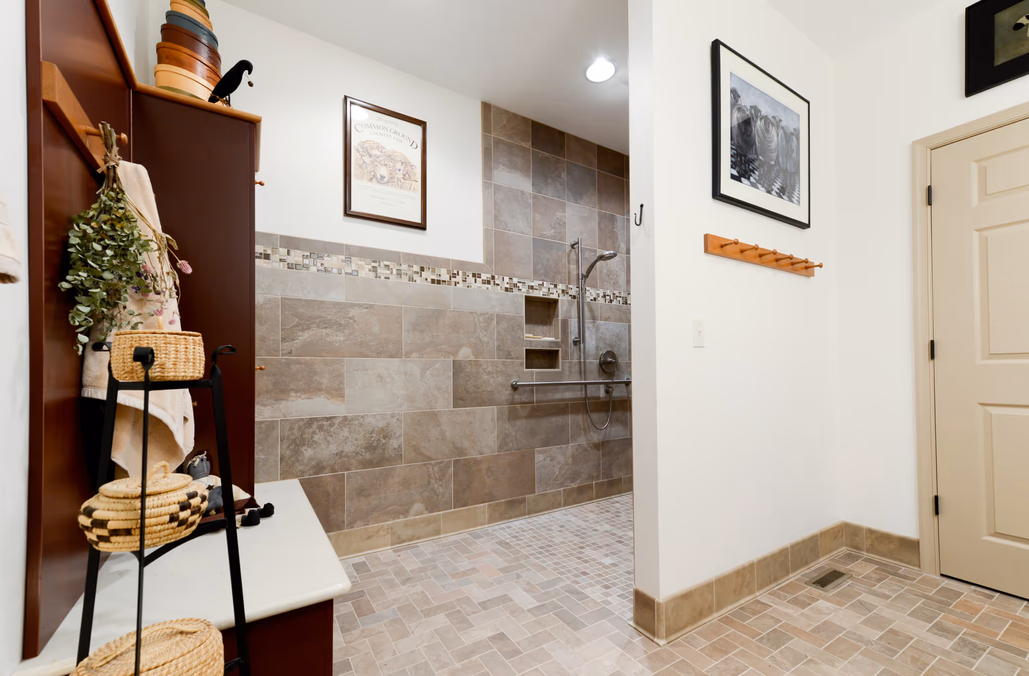 Spacious bathroom with a modern walk-in shower and neutral tile design, featuring accessibility features, located in Carlisle, PA.