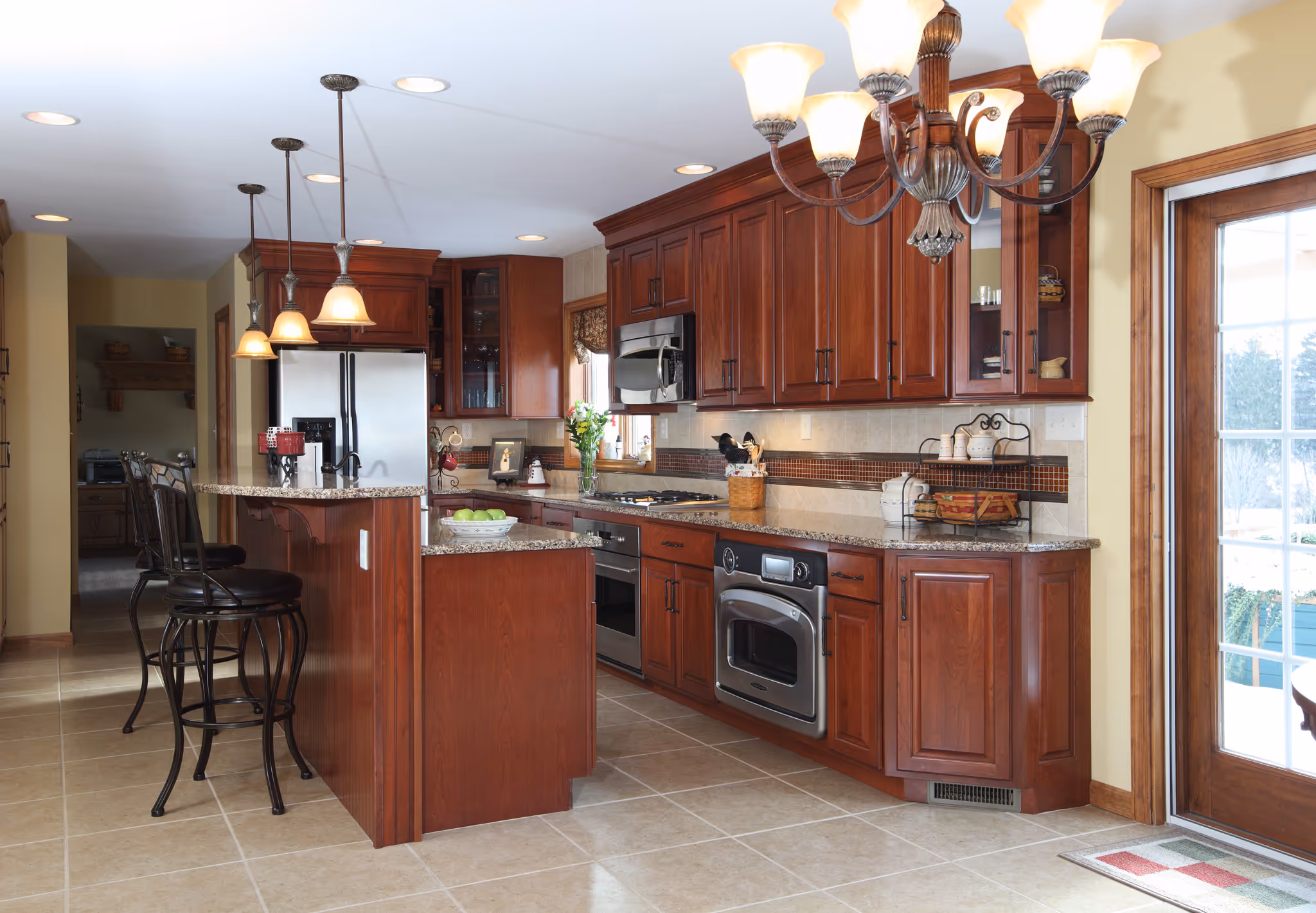 Elegant modern kitchen with dark wood cabinets, stainless steel appliances, and granite countertops in york, pa.