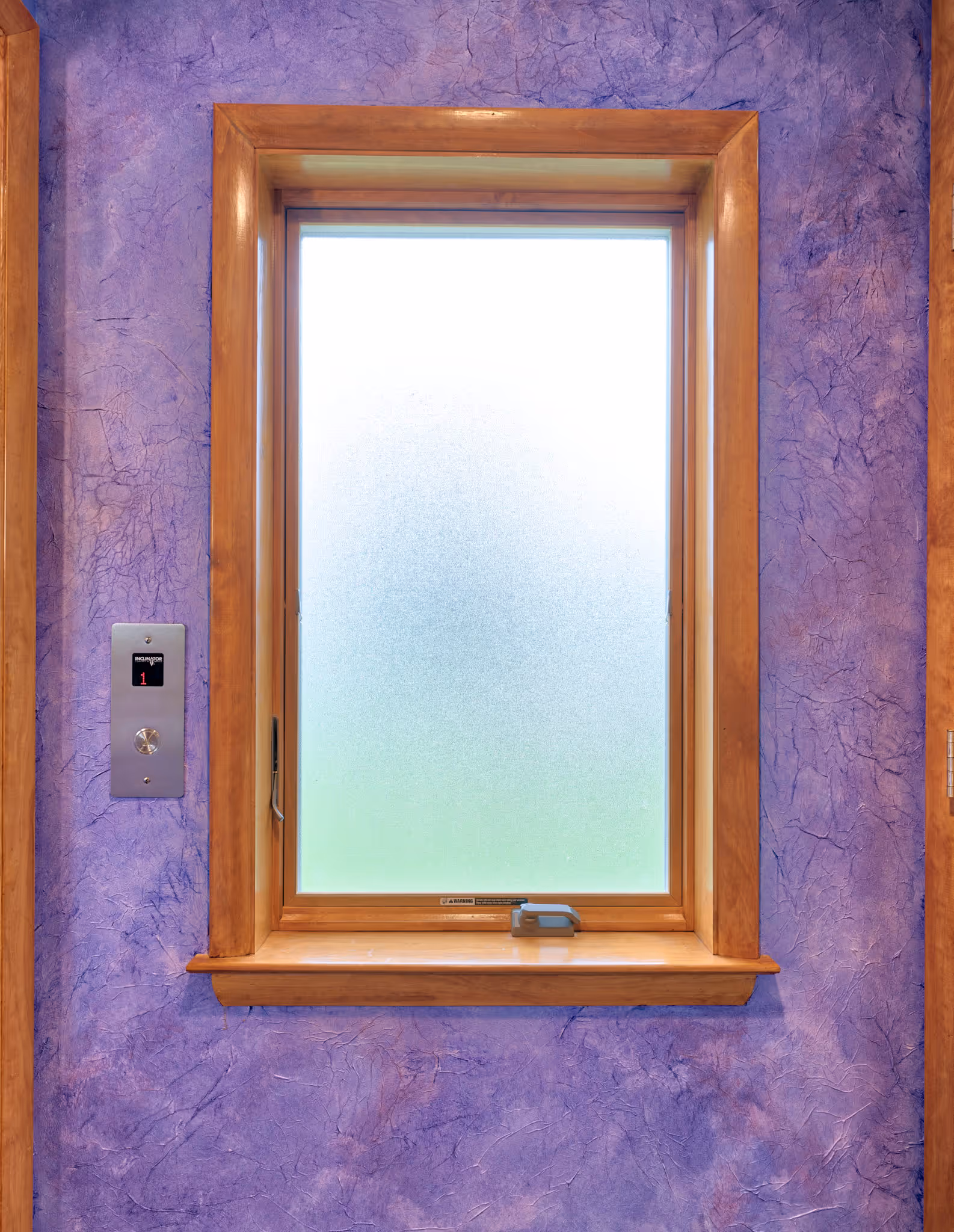 Contemporary interior featuring a frosted window with a purple textured wall in Camp Hill, PA