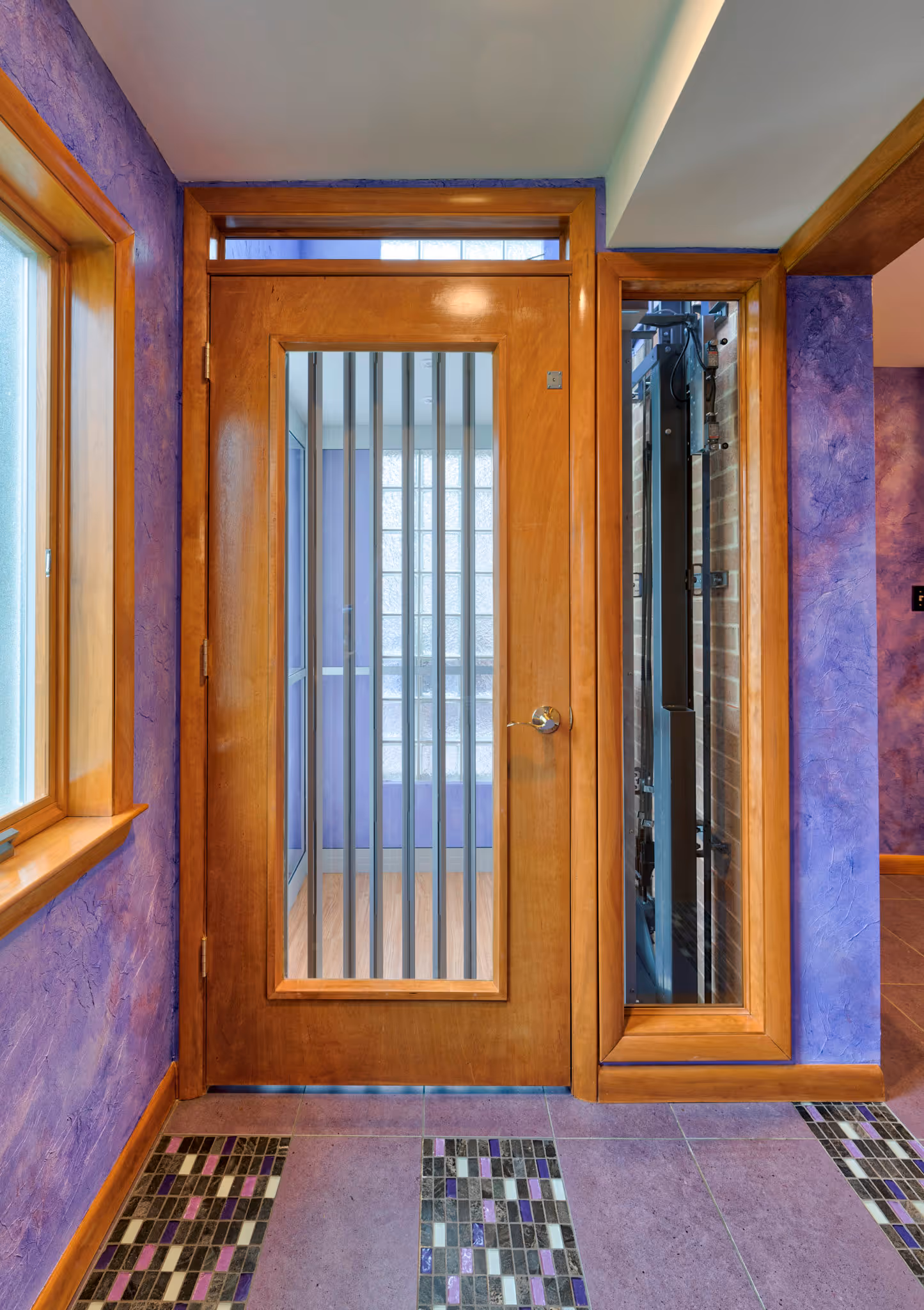 Vibrant entryway with purple walls and unique tile flooring in Camp Hill, PA.