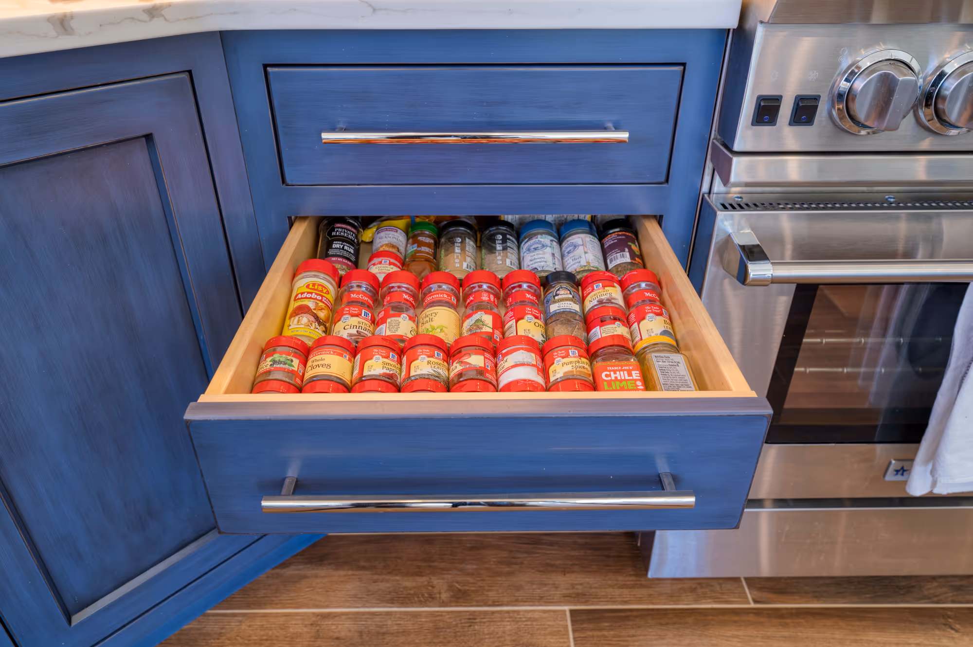 Modern kitchen spice drawer filled with an organized selection of spices and condiments in etters, pa