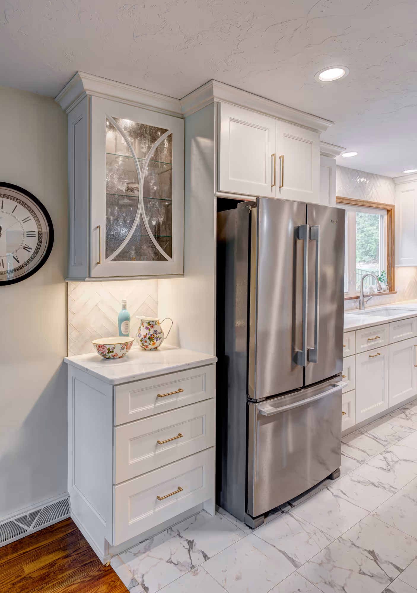 Modern kitchen with white cabinets, stainless steel appliances, and marble countertops in gettysburg, pa